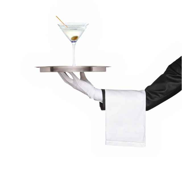 Butler holding tray with a martini on it.